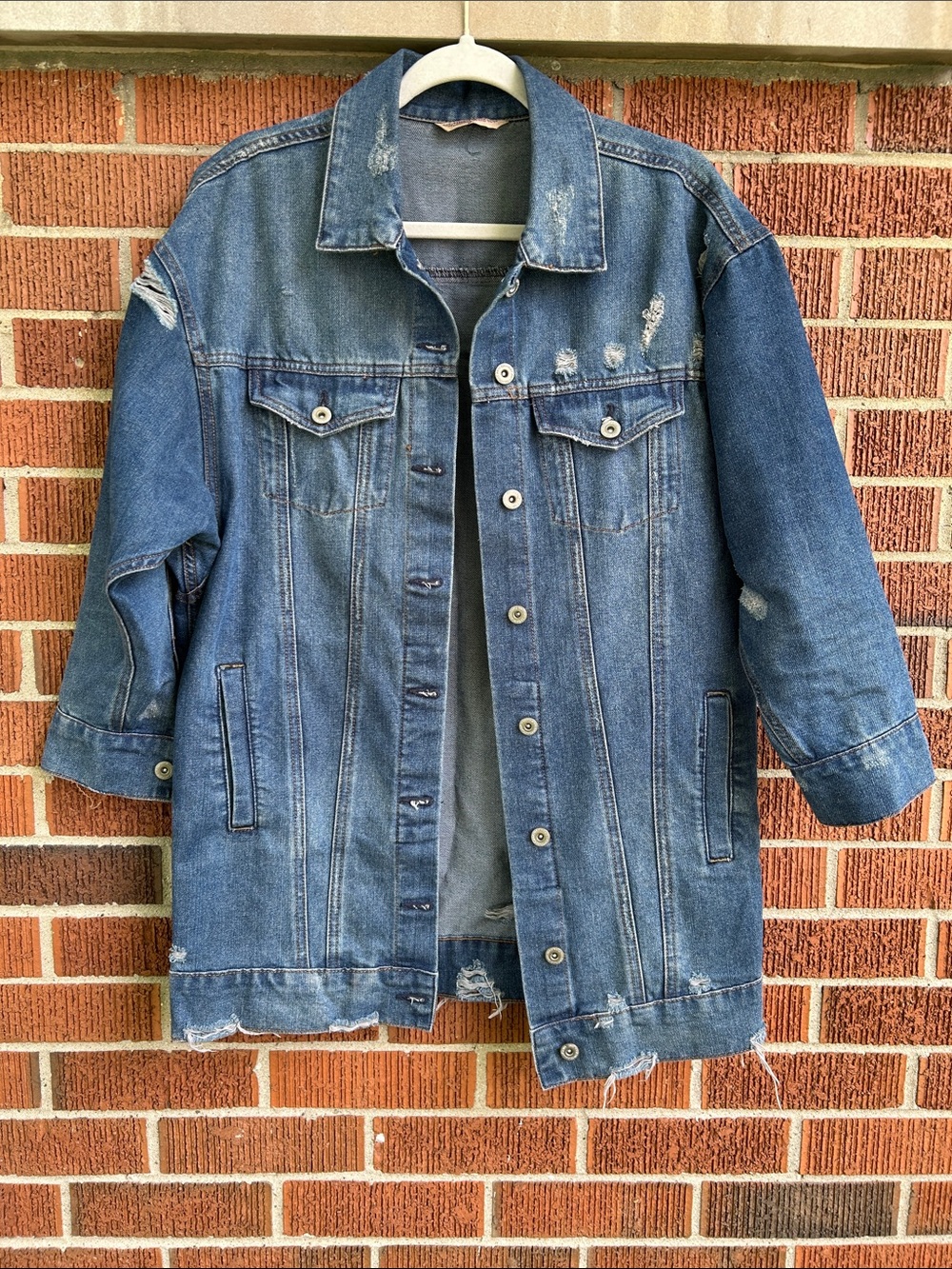 Distressed Blue Denim Jacket, longer length. 3/4 length sleeves.
